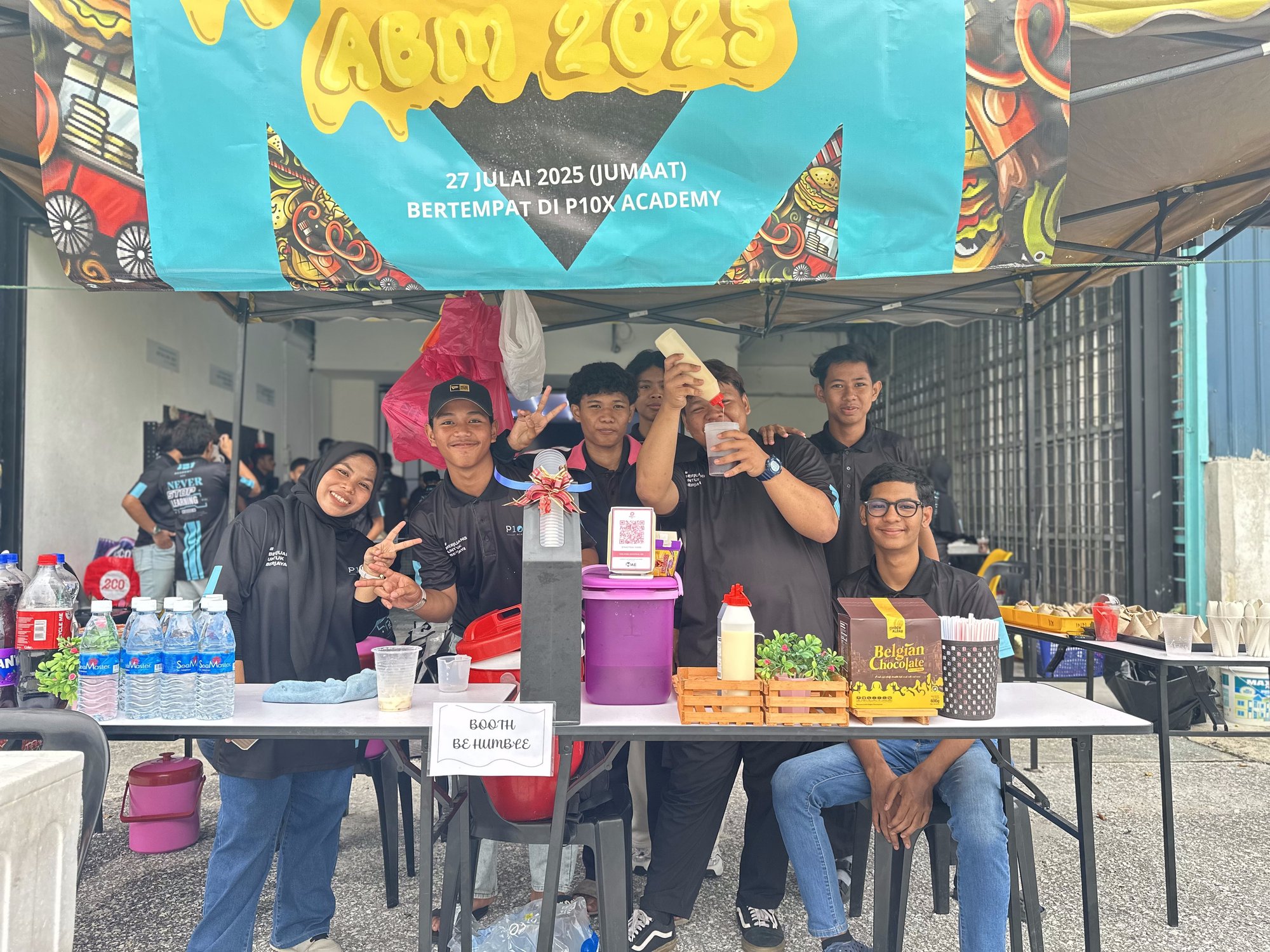 Students running a food stall at a campus event