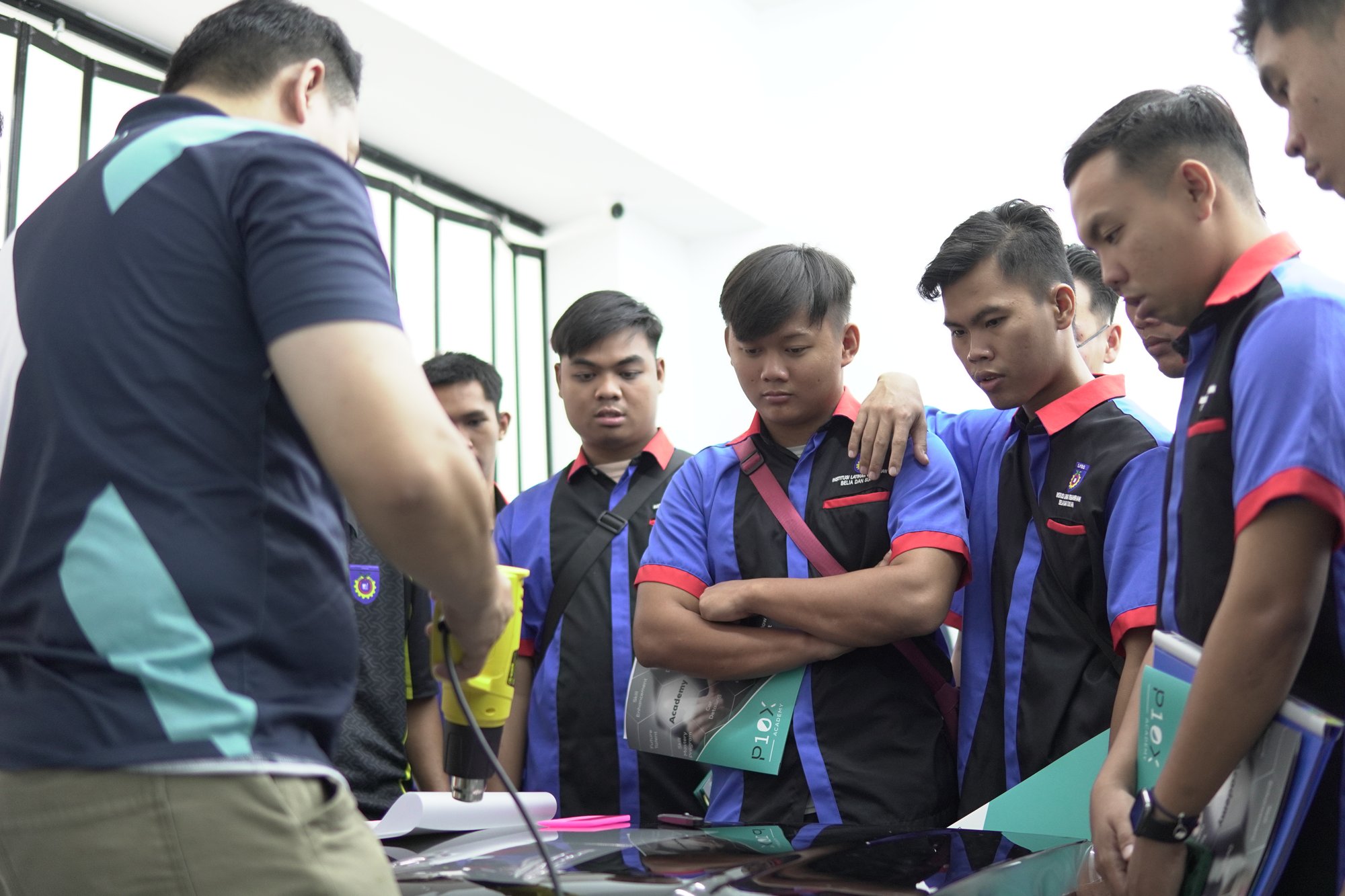Students gathered around a tint demo table