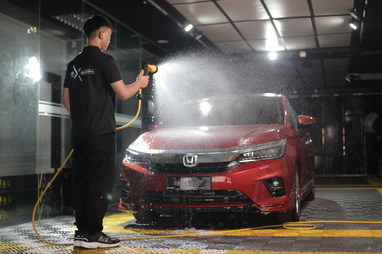 P10X Academy students performing hands-on car detailing training
